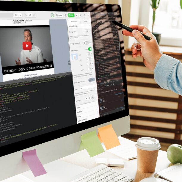 Designer working on an email template on desktop computer