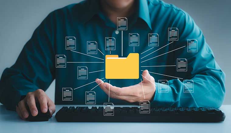 Man holding a virtual computer directory (yellow). Visualizing data