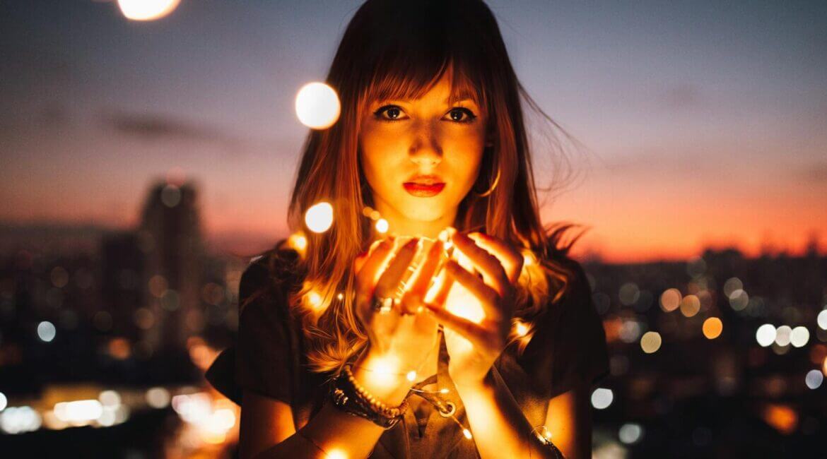 woman holding fireflies