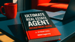 A vibrant, high-contrast landscape image with a 16:9 aspect ratio. The scene features a modern coffee table in a stylish office or living room. On the table is a bold, hardcover book titled 'Ultimate Real Estate Agent Recruitment Guide' with a black, white, and red (#dd0000) color scheme matching MNKY.agency branding. The book cover also includes the author's name 'J. Stuart Hill' and the company name 'MNKY.agency'. The setting includes a red coffee mug, a sleek laptop, and a small plant. The lighting is bright and dynamic, with a clean, modern aesthetic.